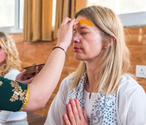 Students practising in the 500-hour yoga teacher training classroom at Rishikesh Yog Nirvana